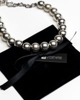 Silver Ball Chain Choker Set featuring chunky silver-tone ball chains, with a black suede pouch underneath.