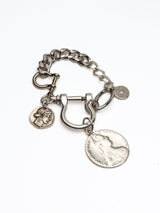 Silver-plated chunky bracelet featuring large ancient coin pendants and an industrial U-lock clasp.
