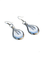 Bold open teardrop earrings in antique silver finish, featuring a sleek design and hypoallergenic materials.