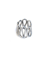 Boho silver spiral statement ring in an intricate design, adjustable fit with a unique geometric pattern.
