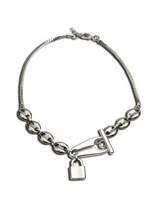 Stainless steel choker necklace featuring a chunky anchor link chain and a padlock pendant.