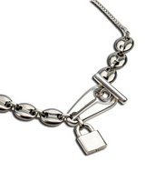 Stainless steel choker necklace featuring a bold anchor link design and a padlock pendant, showcasing an edgy style.
