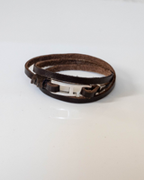 Brown leather wrap bracelet for men, featuring a zamak buckle, designed to wrap three times around the wrist.