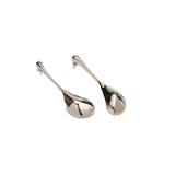 Large, long, abstract earrings in silver, featuring a sculptural water drop design suitable for modern styling.