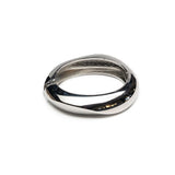 Polished silver chunky cuff bangle featuring a smooth, rounded design with an open interior for a lightweight fit.