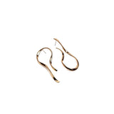 Large asymmetric dangle earrings in rose gold with unique hammered, irregular lines design.