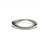 Chunky silver cuff bangle with a sleek, polished finish, featuring a unique geometric design.