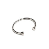 Silver plated open bangle with rounded ends, showcasing a sleek and minimalist design, suitable for stacking with other bracelets.