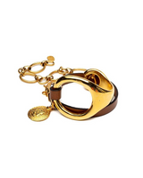 Gold triple wrap bracelet features a beige leather strap and a chunky metal hoop, secured with a stainless steel chain.