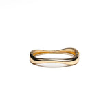 Chunky gold metal cuff bangle with a unique wave design, featuring a high-polished finish and hollow interior.