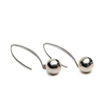 Silver metal chunky ball drop earrings with a sleek hook design, featuring reflective spherical beads.