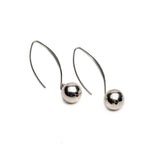 Silver metal chunky ball drop earrings with exaggerated minimalism, featuring sleek hooks and shiny orb details.