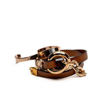 Honey gold metal and brown leather wrap bracelet with chunky double links and a stainless steel chain design.