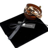 Brown leather wrap bracelet with honey gold metal double links and chunky stainless steel chain, presented on a black pouch.