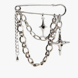 Silver safety pin brooch with chains and cross pendants, featuring a mix of textured and smooth metal links.