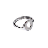 Sculptural wide cuff bracelet with an exaggerated irregular loop design in high-shine metal.