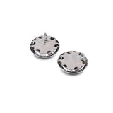 Oversized dome stud earrings featuring a polished metallic finish and a lightweight zinc alloy construction.