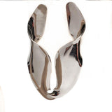 Sculptural silver statement earrings with irregular twisted design, lightweight, 4 inches long. Perfect for bold styles.