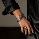 Multi-strand Rock-Style Hematite Gemstone Wrap Bracelet featuring polished black hematite beads and silver-tone accents.