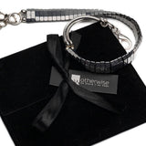 Multi-strand wrap bracelet featuring polished hematite beads in a gunmetal sheen, accented with a silver-tone clasp.