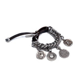 Chunky silver-plated bracelet with vintage coin charms and a soft leather closure, featuring bold link chains.