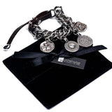 Chunky chain bracelet with silver-plated vintage coins, leather closure, and a soft dark brown strap detail.