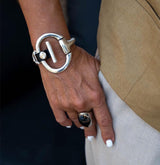 Standout black leather and horsebit metal, Equestrian cuff bracelet, Unode50 style bracelet, Chunky brutalist jewelry