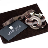 Bold textured disc bracelet with leather and strass, rock style statement bracelet for a strong look