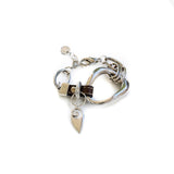 Unique metal and leather bracelet features an irregular silver design, with a brown leather strap and adjustable chain.