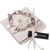 Bold chunky chain anklet in silver with a T-clasp, featured on a suede pouch, showcasing a heavy, antique-style chain.