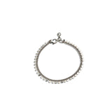 Dainty 999 silver antique plated anklet with round charms, featuring an adjustable chain and minimalist design.