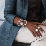 Unique double wrap bracelet in unode50 style, metal and leather cuff with stainless steel chain for a sharp and chic look. a standout piece!