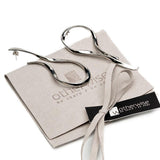 Large asymmetric dangle earrings in silver-tone metal with hammered stud tops and flowing, irregular wire designs.