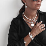 Silver Lava Necklace Set with lava stone choker, white leather pendant necklace, and adjustable silver bracelet