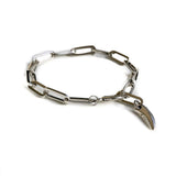 Silver stainless steel anklet featuring an oval link chain and a stylish claw accent, perfect for a layered boho look.