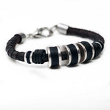 Men's bracelet featuring silver-plated and leather elements on dark brown PU leather with adjustable length.