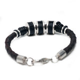 Men’s bracelet featuring strong silver-plated and black leather elements on dark brown woven PU leather.