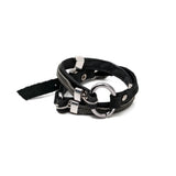 Black leather wrap bracelet featuring iron chains and metal elements, secured with a buckle for an edgy look.