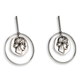 Statement earrings featuring brass coin pendants in a round hoop design, finished in silver tone.