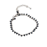 Silver anklet with faceted cut glass beads in silver night color, adjustable length with steel extension chain.