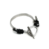 Cuff bracelet with leather and an asymmetric bar clasp, unique women's bracelet for gift.