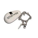 Rock-style silver bracelet featuring a stainless-steel chain, Swarovski crystal charm, and shackle pendant.
