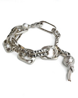 Chunky hammered metal link bracelet with silver leather and wrought ball pendant, featuring an adjustable extension chain.
