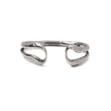 Unique hammered bangle with an open cuff design, featuring a bold, layered look in silver-tone metal.