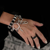 Edgy stainless steel bracelet with black leather in chain and oversized buckle, chunky wrap rocker cuff