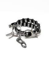Bracelet with black and silver links on a white background