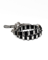 Black and silver chain bracelet on a white background