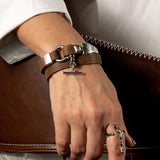 Leather and metal wrap bracelet with brown Greek leather, silver-plated Zamak shackle, and magnetic closure