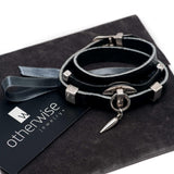 Edgy wrap-around black leather bracelet with silver-plated designs
