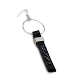 Funky earrings made of black leather with strass and silver-plated elements, different earring on each ear worn together or individually
